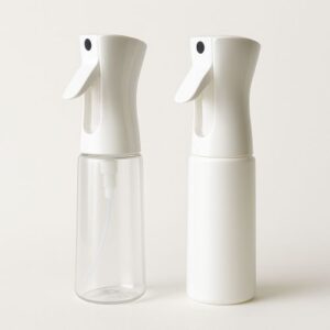 Two continuous fine-mist spray bottles with white nozzles, ideal for gently misting seedlings and indoor greenhouse plants.