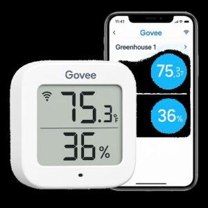 Digital humidity and temperature monitor showing greenhouse conditions.